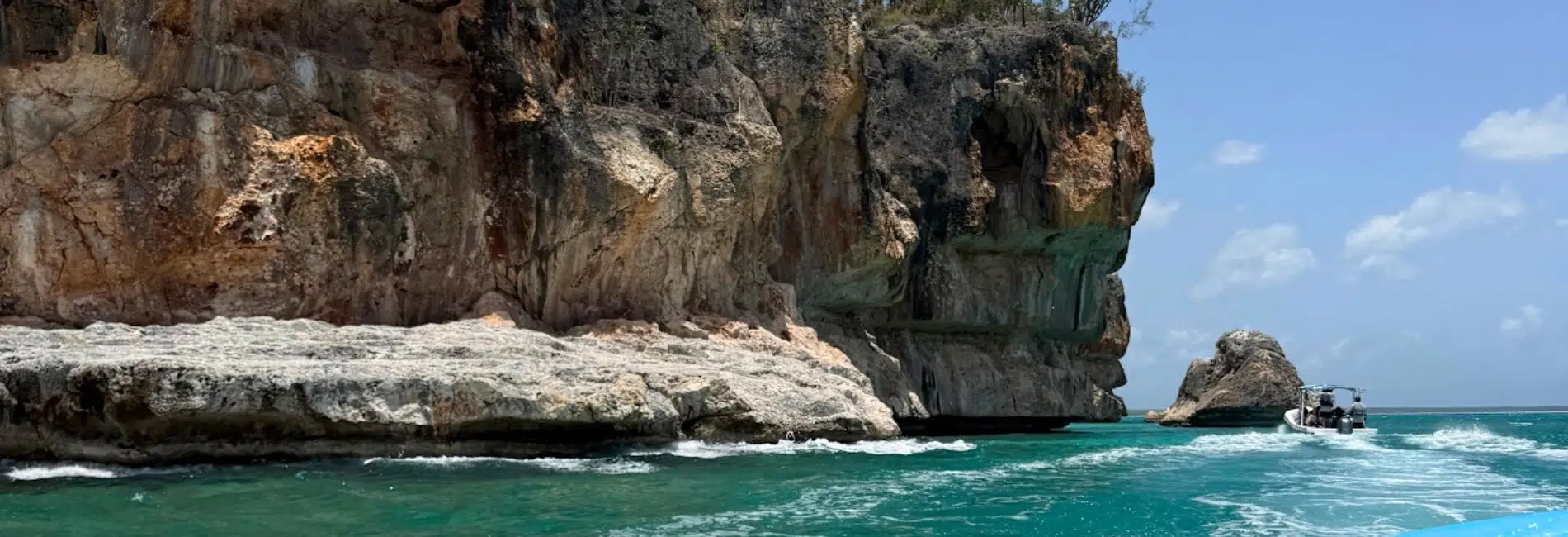 Boat ride past sea cliffs of Jaragua National Park