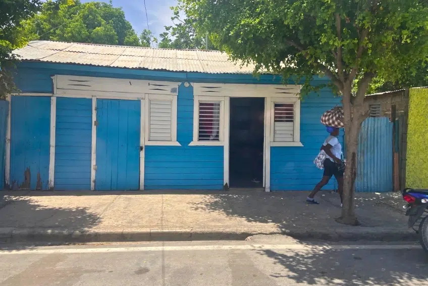 Bright blue wooden house in Pedernales town