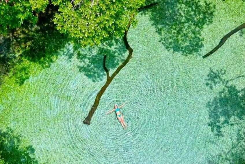Floating in crystal clear water at Jaragua National Park