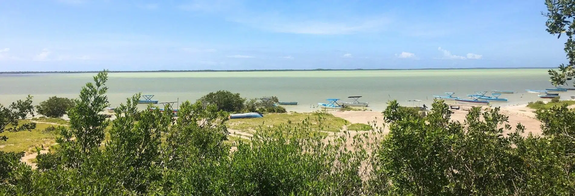 Panoramic view of Laguna de Oviedo boats and shoreline