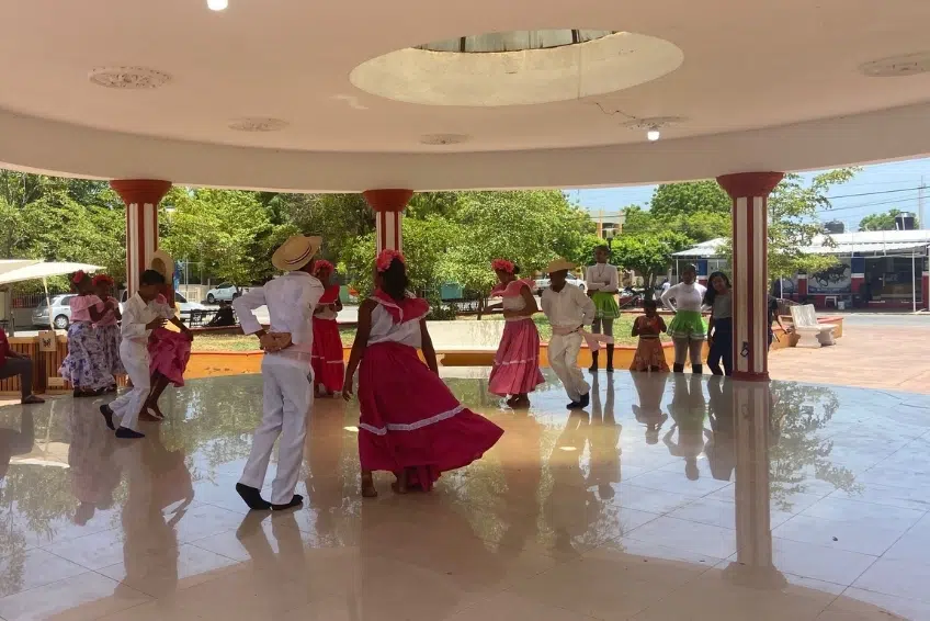 Traditional Dominican folk dancers performing in Pedernales plaza gazebo