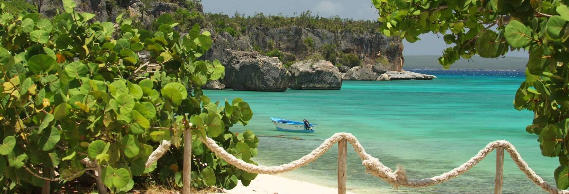 Boat moored in turquoise Bahia de las Aguilas cove