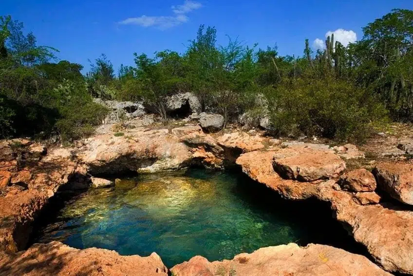 Crystal clear natural rock pool at Pozos de Romeo