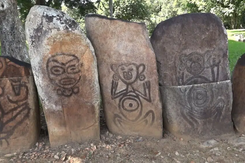 Standing stones with carved Taíno petroglyph figures