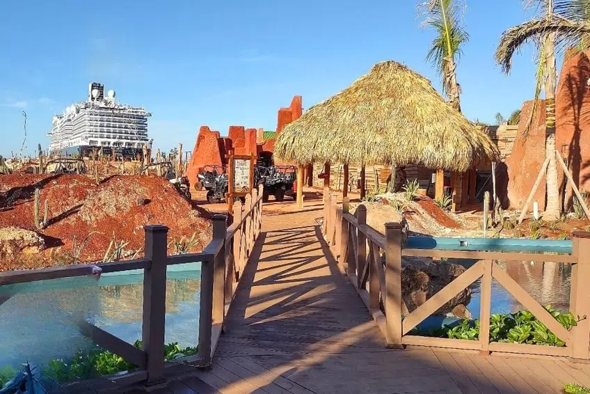 Wooden bridge leading to thatched hut at Cabo Rojo Cruise Port