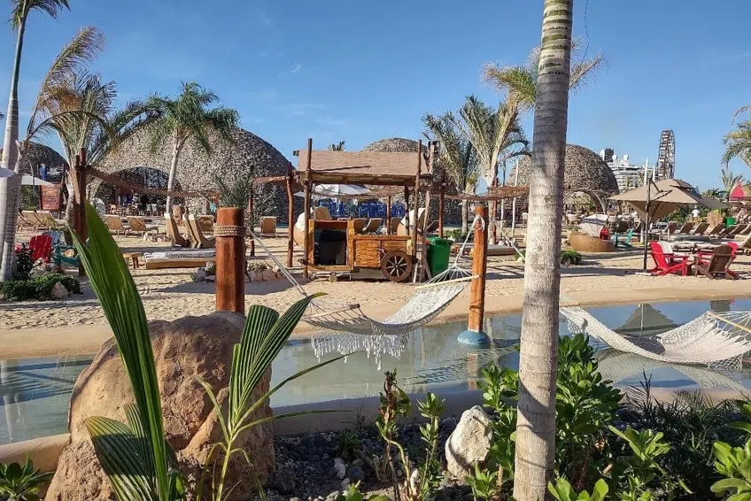 Beach club with hammocks over pool at Cabo Rojo Cruise Port