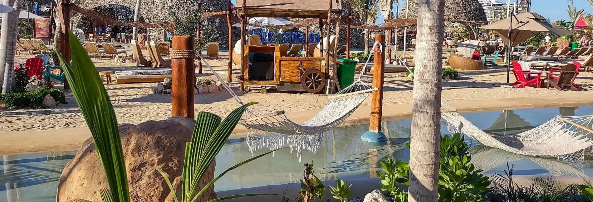 Beach club with hammocks over pool at Cabo Rojo Cruise Port