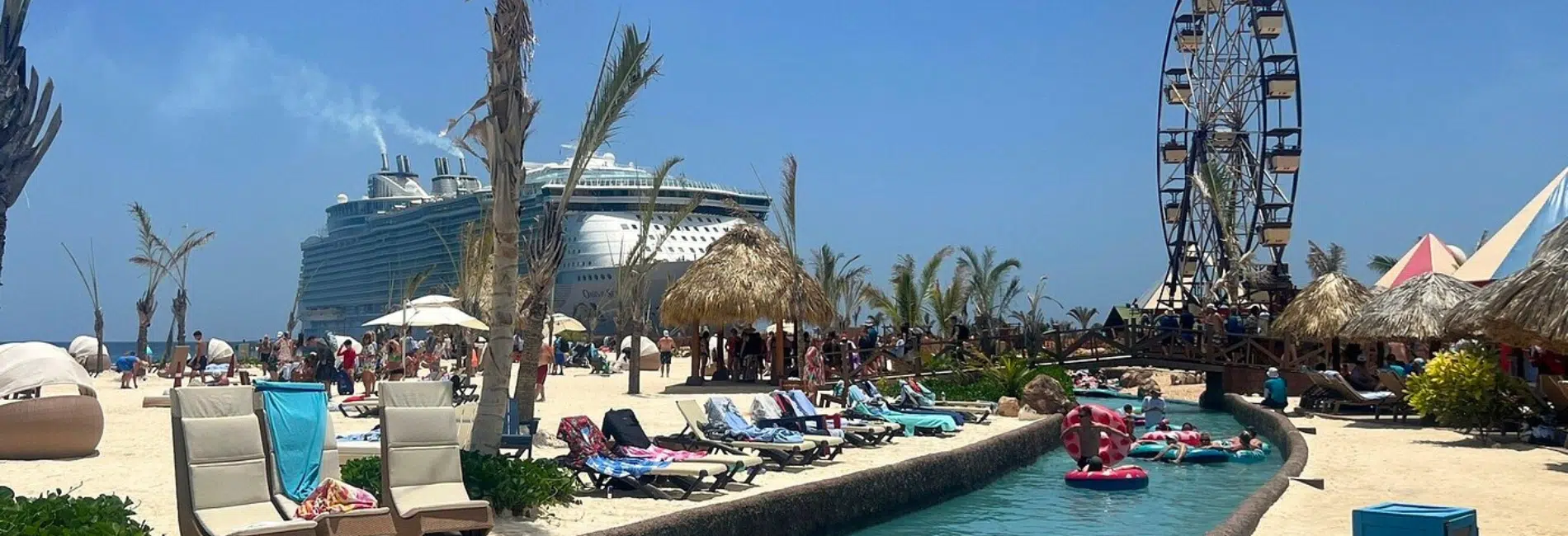 Guests floating on lazy river with cruise ship and Ferris wheel at Cabo Rojo Cruise Port
