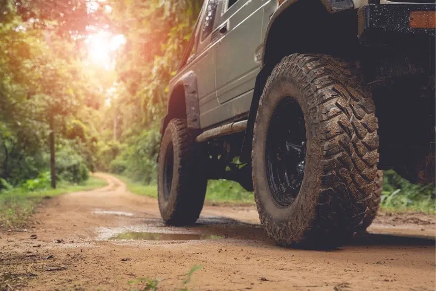 Driving Yourself Muddy 4x4 vehicle driving along a dirt road