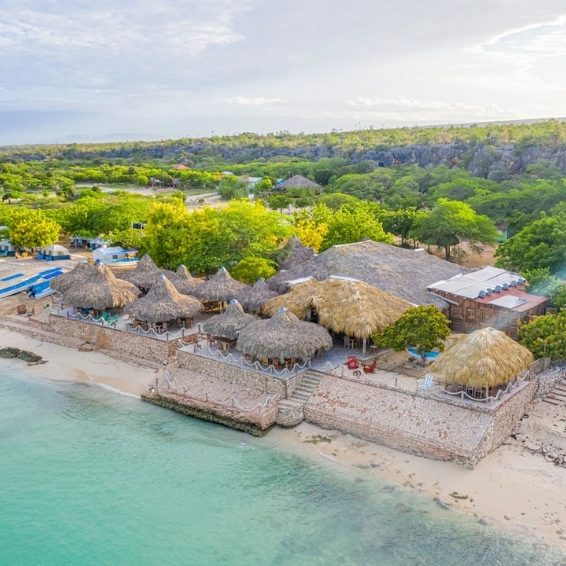 Where to Stay in Pedernales & Cabo Rojo - Glamping EcoLodge Cueva de las Aguilas View of beachfront Glamping EcoLodge Cueva de las Aguilas with thatched roof huts
