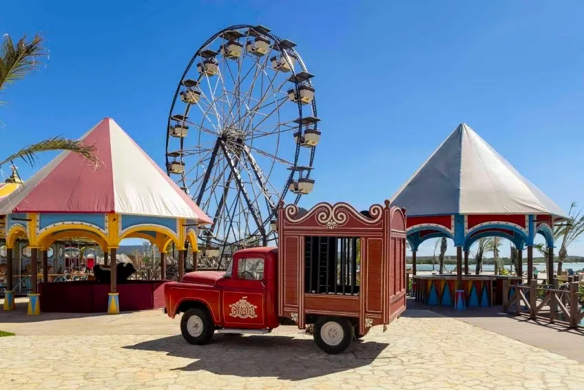 Vintage circus truck and Ferris wheel at colorful kid friendly area at Cabo Rojo Cruise Port Guide