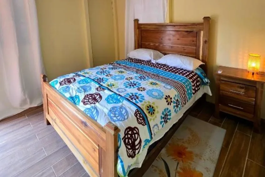 Room at La Casita de La Cueva with colorful bedding