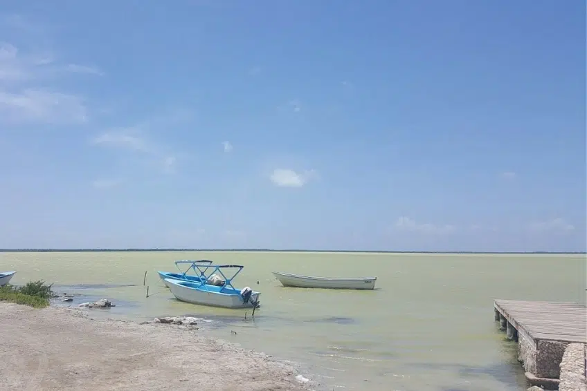 Two boats moored at dock in Laguna de Oviedo