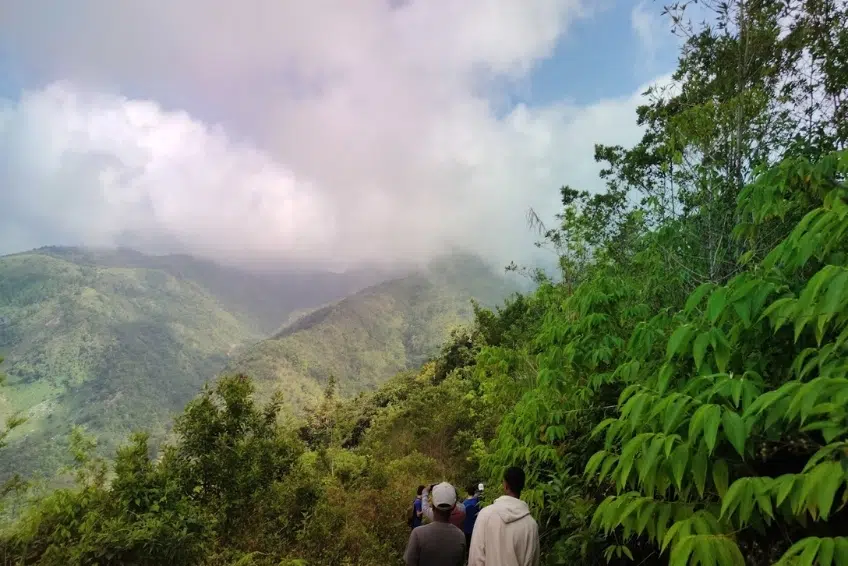 Hikers on mountain trail in Sierra de Bahoruco National Park