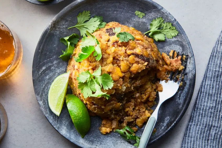 Dominican mofongo served with cilantro, lime wedges