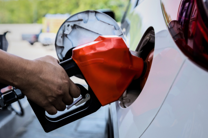 Where To Stay - Fill Your Gas Tank Pumping gas into a rental car in Cabo Rojo, DR