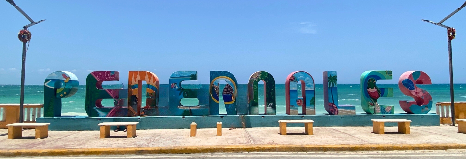 Bright and colorful Pedernales sign on the Dominican Republic waterfront on Cabo Rojo