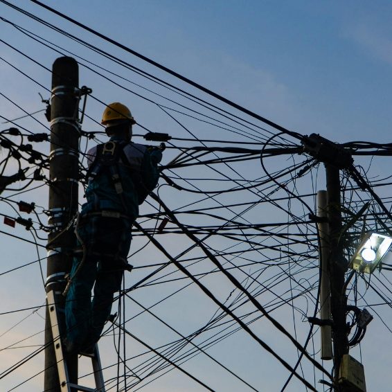 Where To Stay - Power Outages Lineman climbing utility pole to restore power