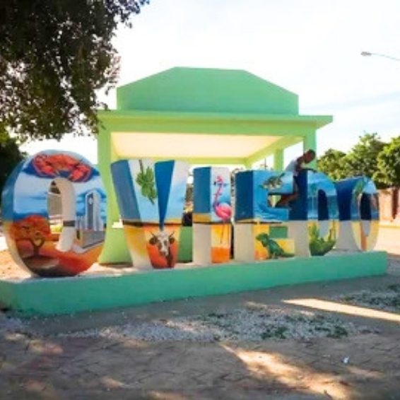 Where to Stay in Pedernales & Cabo Rojo - Oviedo Colorful painted Oviedo town welcome sign with wildlife murals