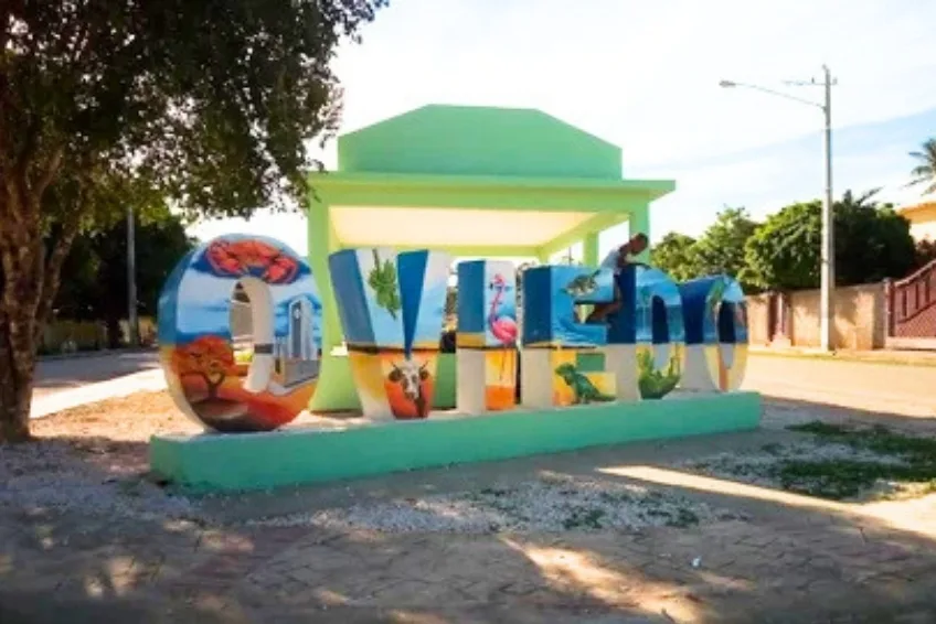 Colorful painted Oviedo town welcome sign with wildlife murals