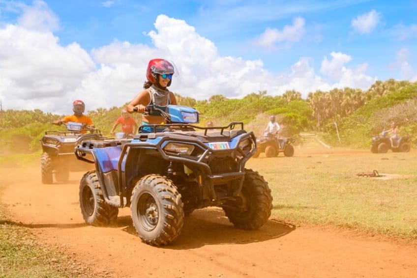 Group ATV tour riding through Cabo Rojo, Dominican Republic