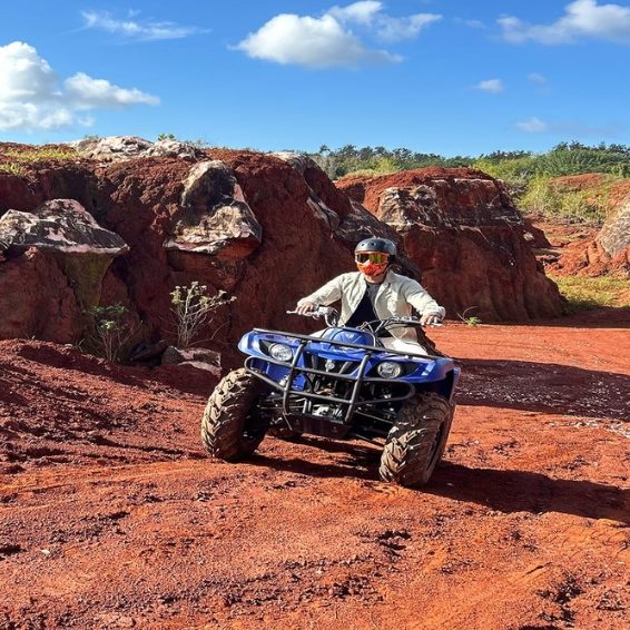 ATV rider exploring red dirt trails in Cabo Rojo