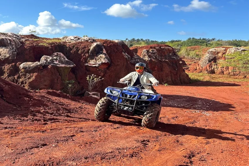 ATV rider exploring red dirt trails in Cabo Rojo