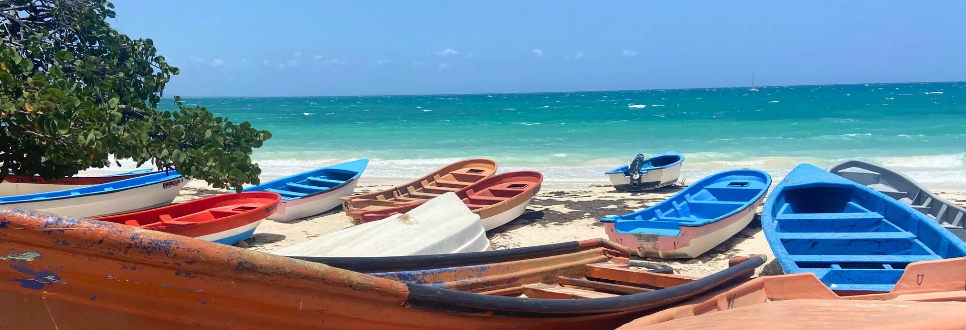Colorful fishing boats lined up on Bahia de las Aguilas in Cabo Rojo