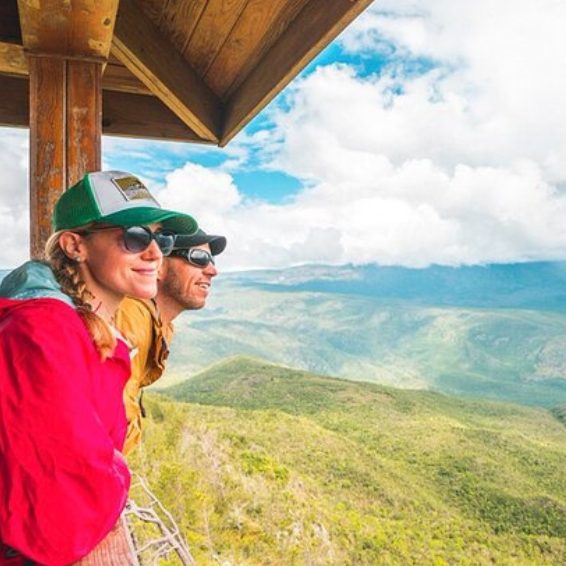 Hikers enjoying mountain views at Hoyo de Pelempito