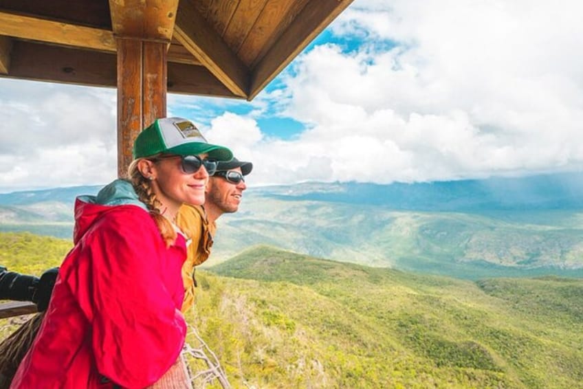 Hikers enjoying mountain views at Hoyo de Pelempito