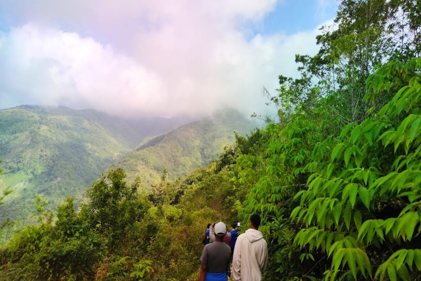 Hikers exploring lush Sierra de Bahoruco mountain trail