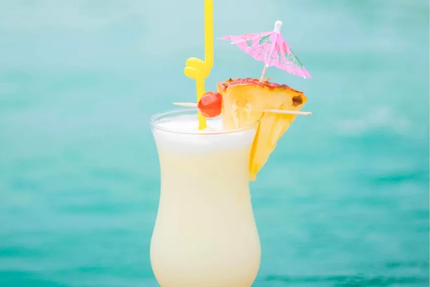 Baby Beach at Port Cabo Rojo, DR Tropical cocktail by the pool with pineapple and umbrella in Cabo Rojo