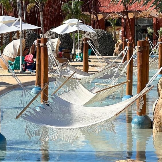 Hammocks over shallow resort pool at Baby Beach Club