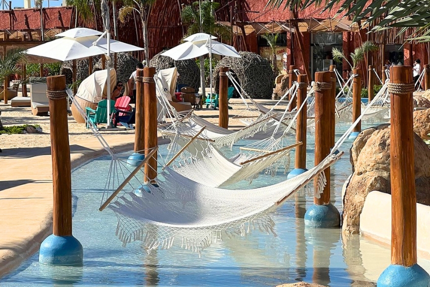 Hammocks over shallow resort pool at Baby Beach Club